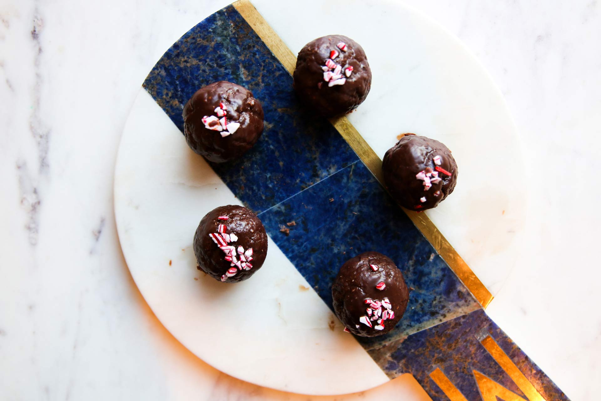 energy balls dipped in chocolate and crushed peppermint